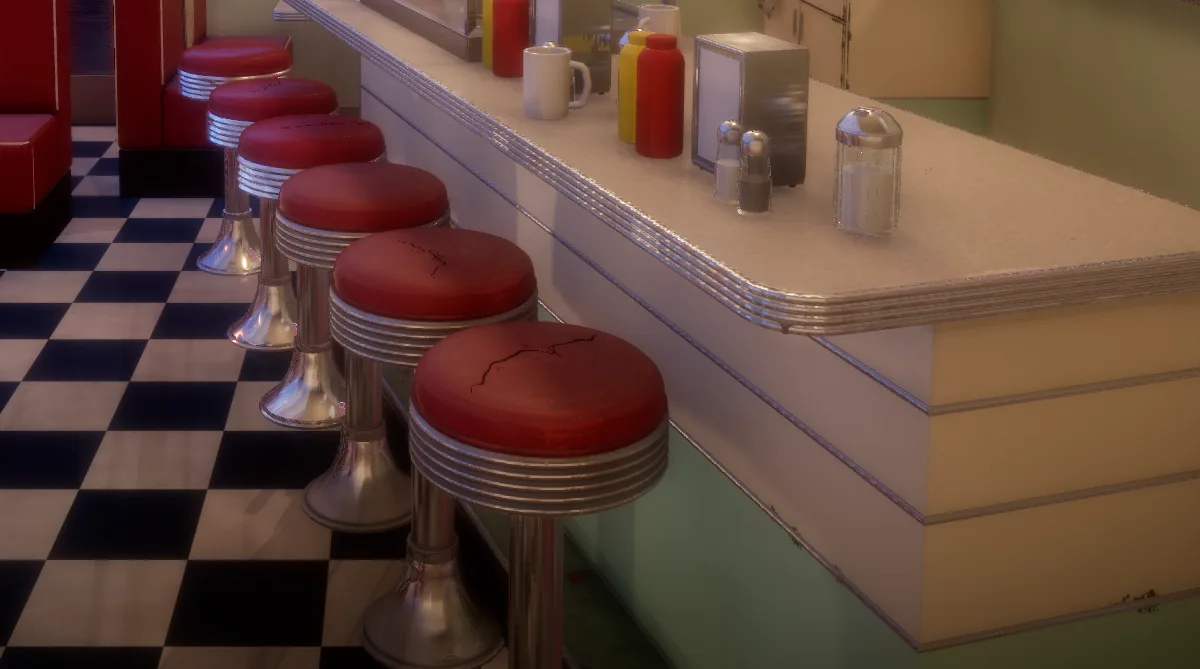Diner stools with cracked red vinyl tops and chrome bases
