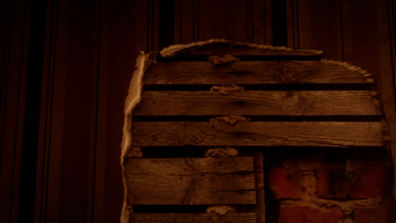 Torn wallpaper showing plaster and brick behind it in the Ashgrove mansion